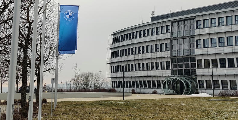 The Energon building, BMW Car IT's location in Ulm The front of an office building with two BMW flags